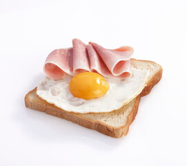 slice of bread with egg and ham, isolated on white background