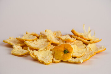 Orange tangerine shells, slices close-up isolated on white background