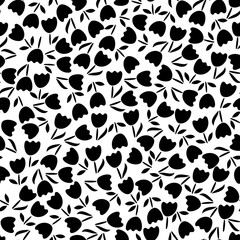 Fototapeta premium Trendy black and white vector texture. Monochrome floral seamless pattern. Fashion, fabric, ditsy print, wallpaper. Hand drawn silhouette flowers and leaves scattered random on white backgroud