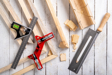 Angular connection of two pieces of wood. Making a wooden frame for a painting. Workplace carpentry...