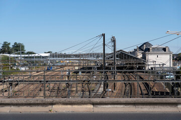 Train in a railway station and tracks