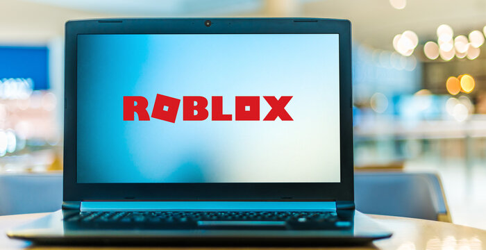 Laptop computer displaying logo of Roblox