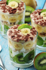 Trifle desserts with bananas, kiwi and yogurt