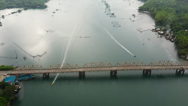 Aerial view of fish ponds for bangus, milkfish. Fish farm, top view. large scale traditional floating fish farms.