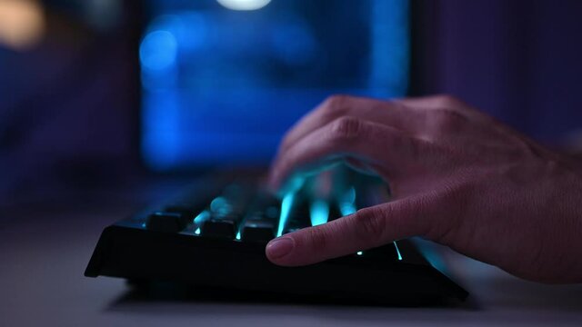 gamer boy typing on keyboard