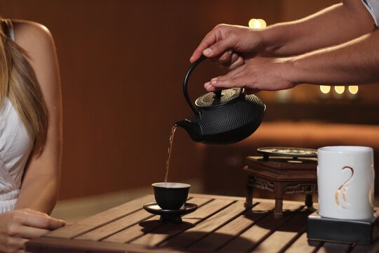 Spa Woman Serving Tea 