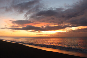 Fototapeta na wymiar New Year Peaceful Hopeful Sunrise on the Beach