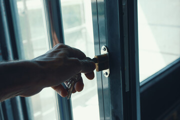 man opens a glass door