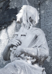 statue of a person in a cemetery