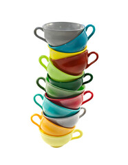 Stack of colorful coffee cups on white background