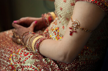 Hindu or Sikh woman with traditional bracelet on her arm