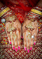 Close up of Mehndi tattoos on the hands of a Hindu or Sikh bride