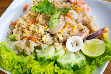 Shrimp fried rice on a wooden table from a top view