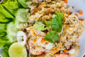 Shrimp fried rice on a wooden table from a top view