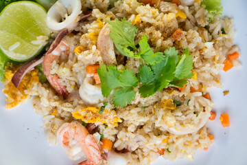 Shrimp fried rice on a wooden table from a top view