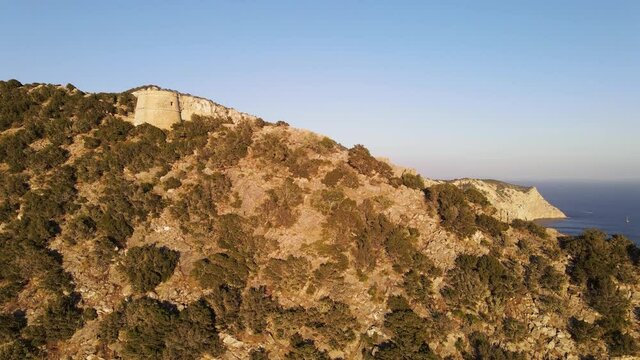 Aerial View of Torre des Savinar Tower near Ibiza, es Vedra and Vedranell islands. Drone footage in the Balearic islands.