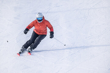 Fototapeta na wymiar People are having fun in downhill skiing and snowboarding 