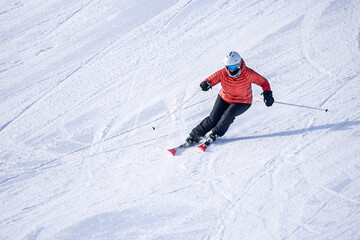 People are having fun in downhill skiing and snowboarding	