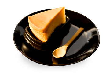 Custard and wooden spoon isolated on white background