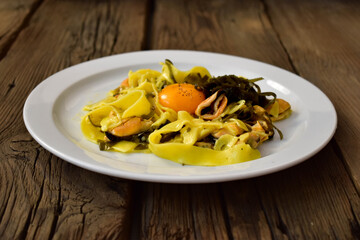Papardelle pasta with mussels, sea grass and yolk