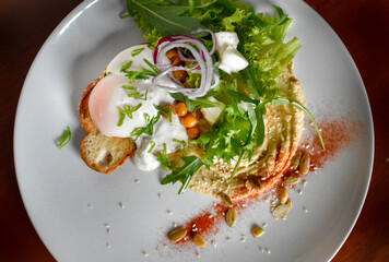breakfast, poached egg on toast, salad, hummus