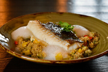 Fried cod and quinoa porridge with vegetables