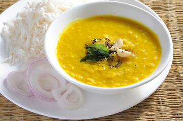yellow daal or toor daal with tadka on top and white rice is every Indian food