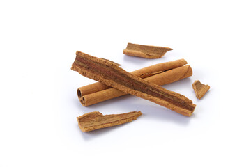 A heap of cinnamon sticks on white background