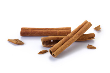 A heap of cinnamon sticks on white background