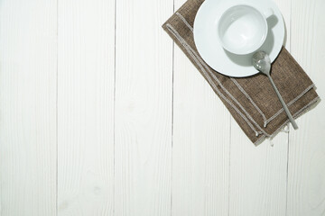 Fototapeta na wymiar Top view of white espresso coffee cup on white saucer.