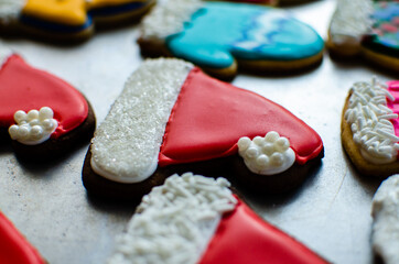 Bright red gingerbread Christmas cookie decorated like Santa Claus' hat