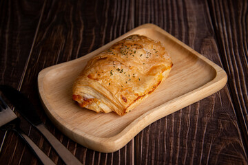 Ham Cheese Croissant on a wooden plate