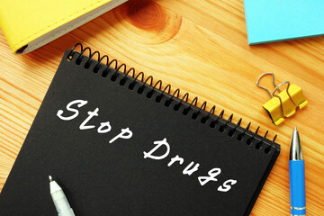 Business concept about Stop Drugs  with phrase on the piece of paper.