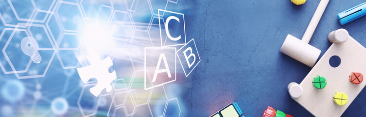 Children's development. Children's wooden toy on the table in the play area. Room of children's creativity and self-development. Wooden constructor.