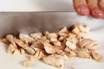 Cutting fried chicken fillet. Making Chicken and Egg Galette Series.