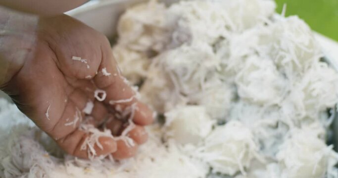 Close up chef hands cooking Coconut Balls or Ka Nom Tom, Thai Traditional Dessert