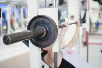 person lifting weights at the gym