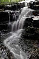 Flow of water on the rocky cascade.