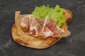 Italian prosciutto pork meat over board