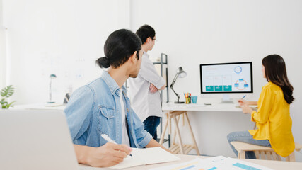 Collaborative process of multicultural businesspeople using laptop presentation and communication meeting brainstorming ideas about new project colleagues working plan success strategy in home office.