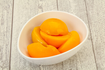 Marinated peaches fruit in the bowl