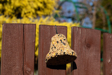Bell from various grains, a delicacy for all the birds in the garden