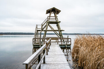 Wooden Rustic Viewing Tower at a Frozen Lake in Latvia