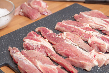 Pork slices on a cutting board