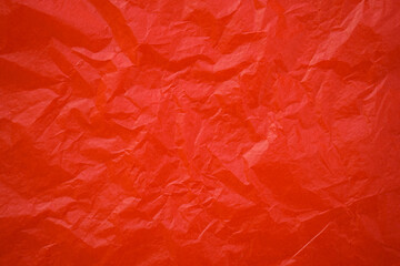 Red crumpled paper texture background 