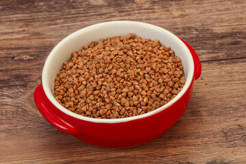 Raw buсkwheat cereal in the bowl