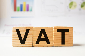 a word VAT on wooden cubes. business concept. business and Finance