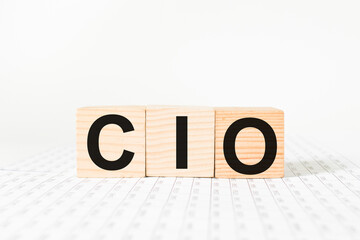 a word CIO on wooden cubes. business concept. business and Finance