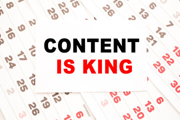 text CONTENT IS KING on a sheet from Notepad.a digital background. business concept . business and Finance.