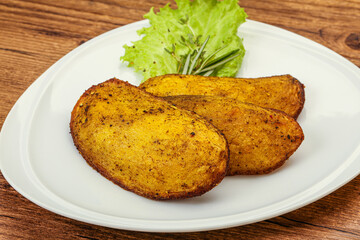 Baked potato with herbs and spices